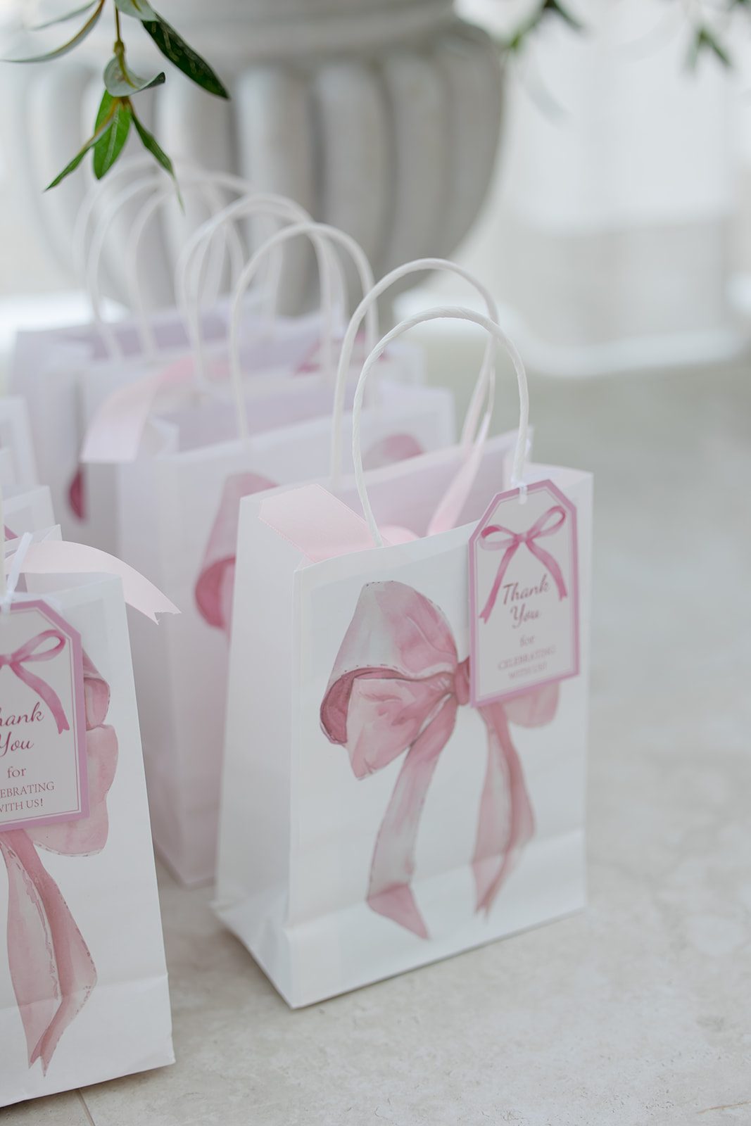 Christening favour bags with pink bow thank-you tags