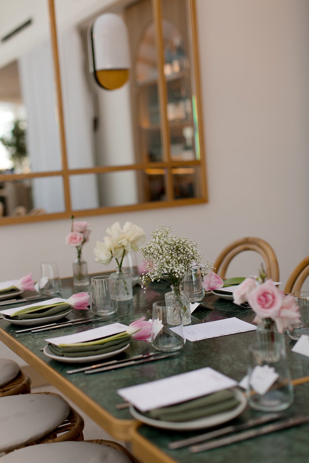 Christening tablescape with pink roses, tulips and baby's breath